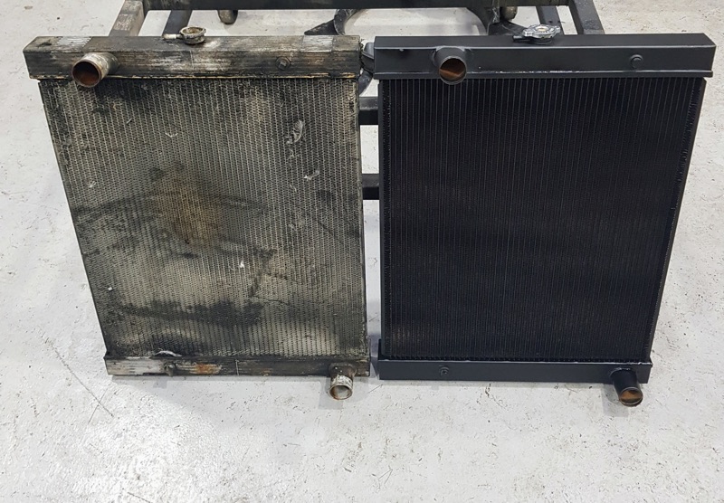 Two matching radiators side by side: on the left a corroded, dirty core, on the right its clean black replacement
