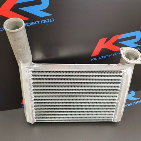 An aluminium intercooler fitted with a new heavy-duty core, in front of the red and blue KR backdrop